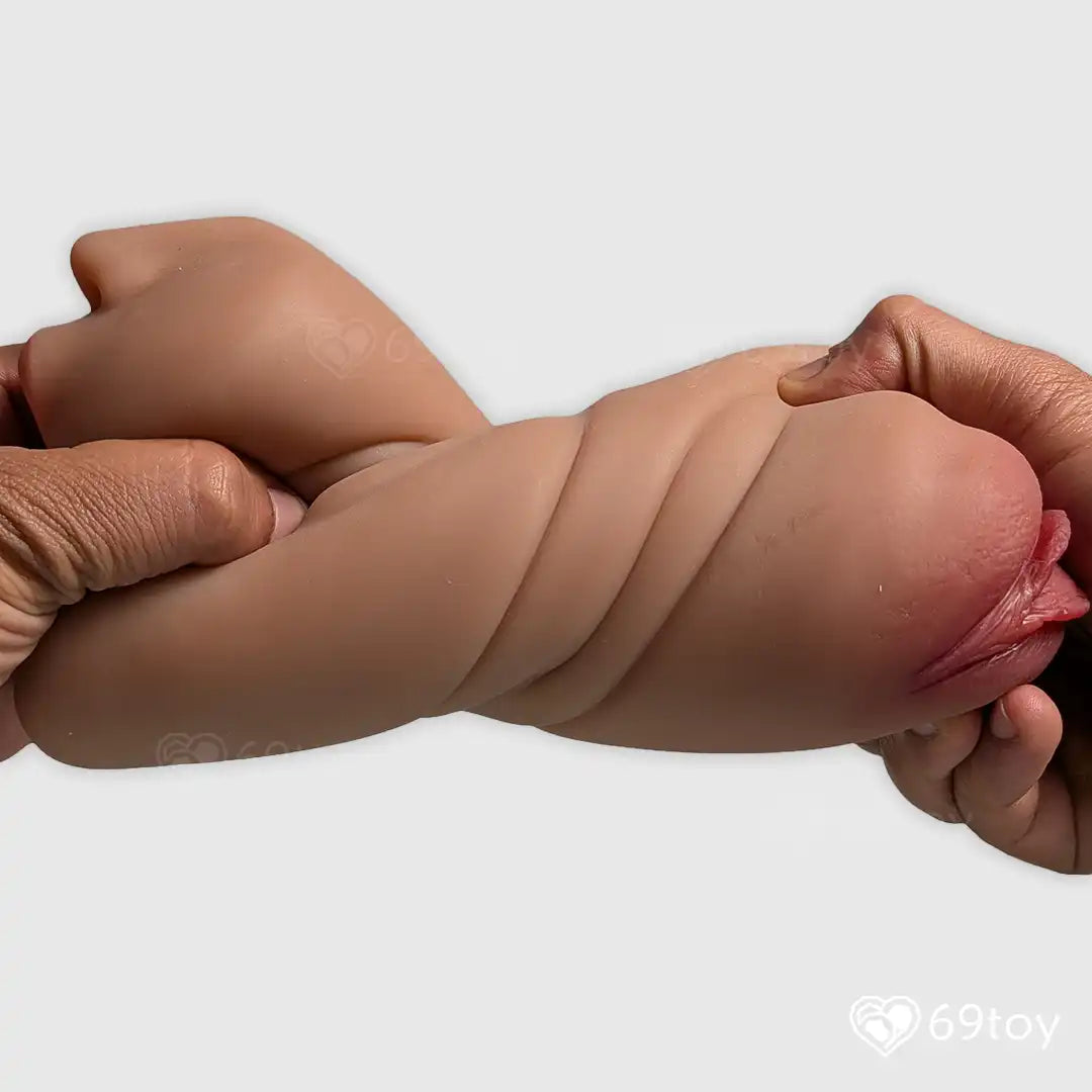 Realistic silicone Pussy Masturbator  showing Stretchability  and hand holding the model  on a white background with 69toy branding.