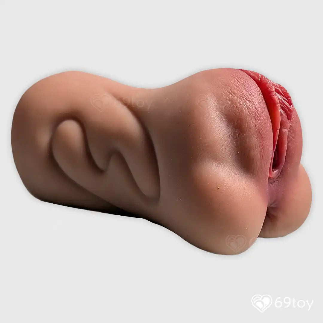 Realistic silicone model of a female pussy   on a white background with '69toy' branding.